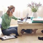 Mid adult woman sitting on floor,